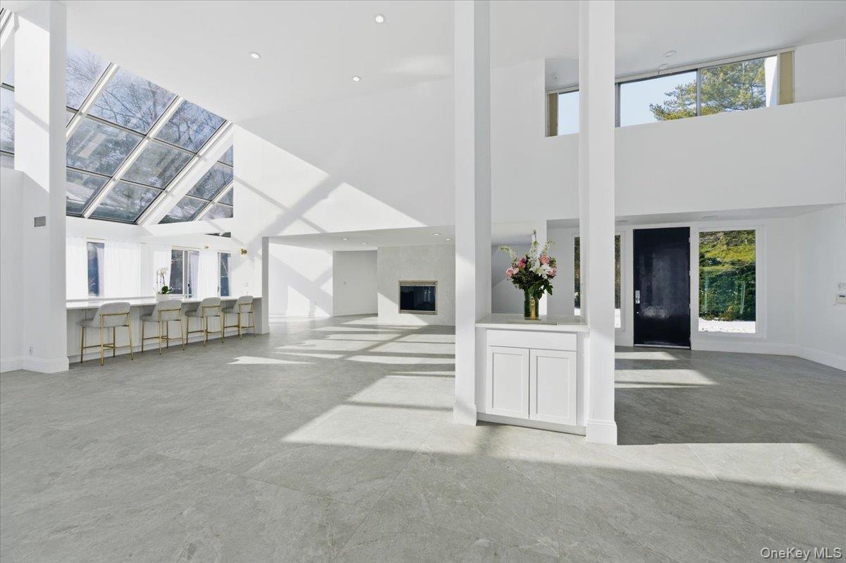454 East Shore Road Great Neck, NY 11024 - Photo 2 of 42 a view of a hallway with entryway and livingroom