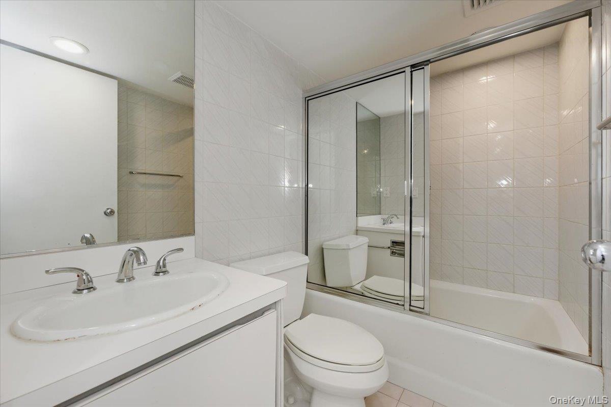 454 East Shore Road Great Neck, NY 11024 - Photo 27 of 48 a bathroom with a sink toilet and shower