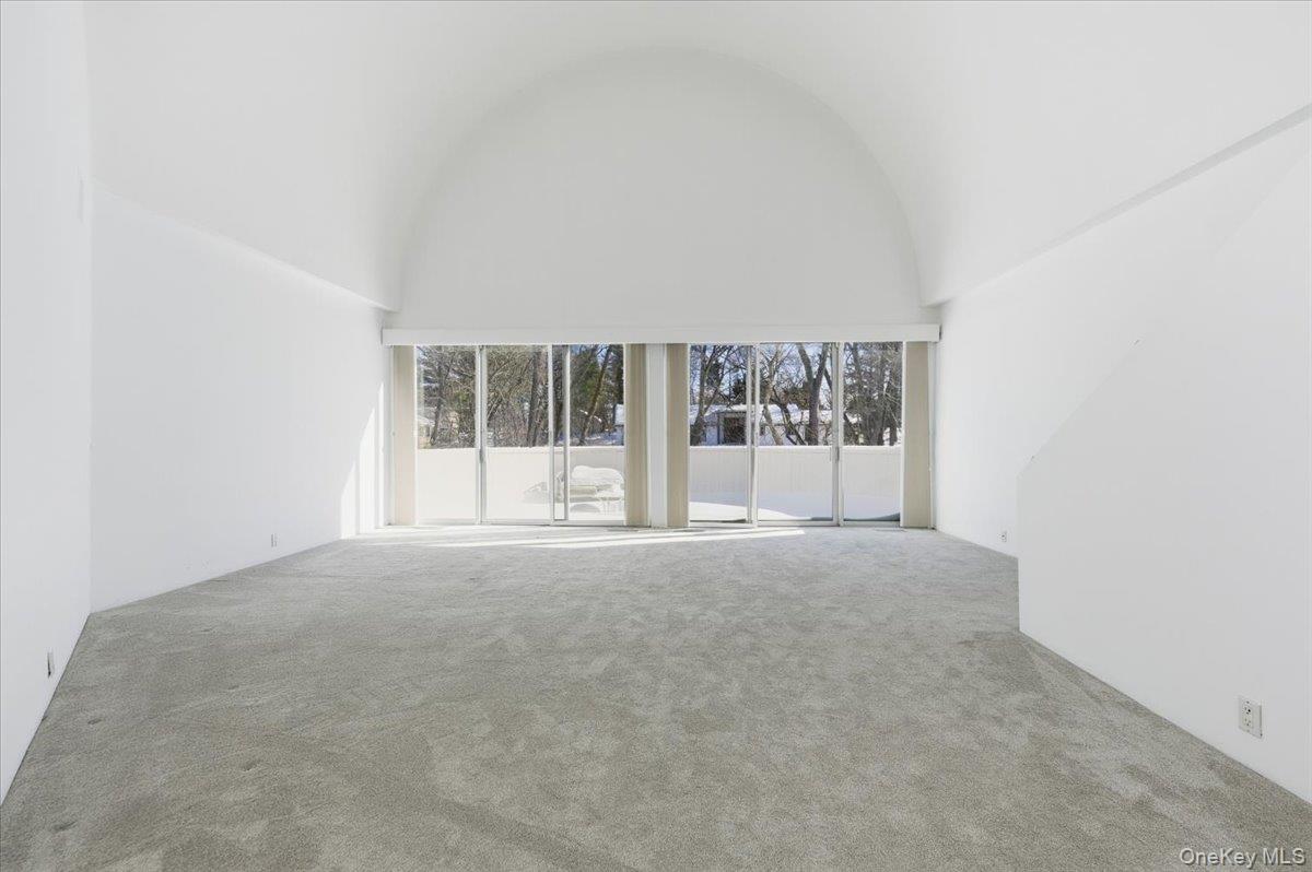 454 East Shore Road Great Neck, NY 11024 - Photo 28 of 48 front view of an empty room with a window