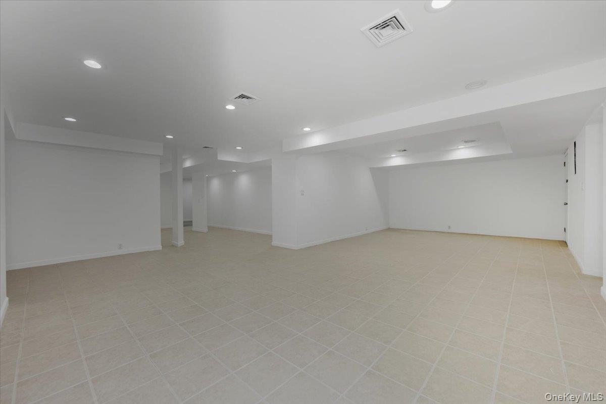 454 East Shore Road Great Neck, NY 11024 - Photo 32 of 42 a view of an empty room