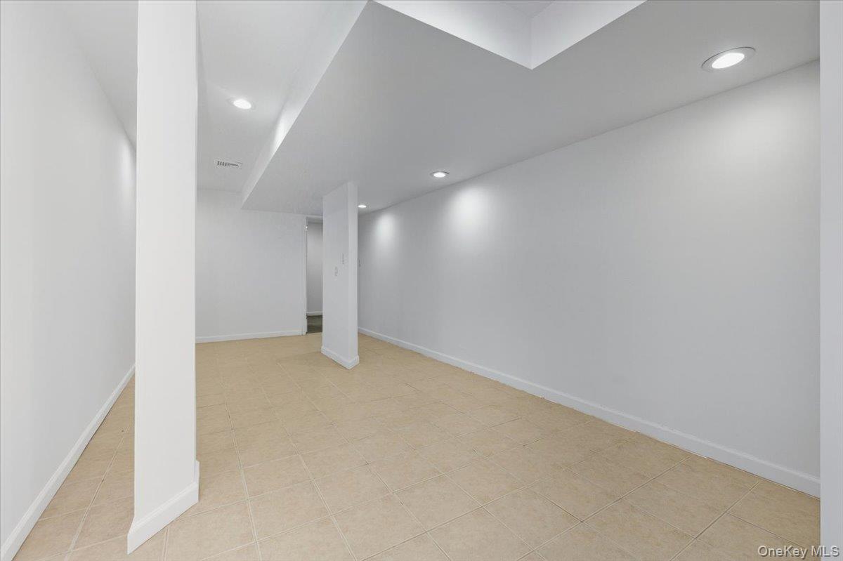 454 East Shore Road Great Neck, NY 11024 - Photo 33 of 42 a view of an empty room