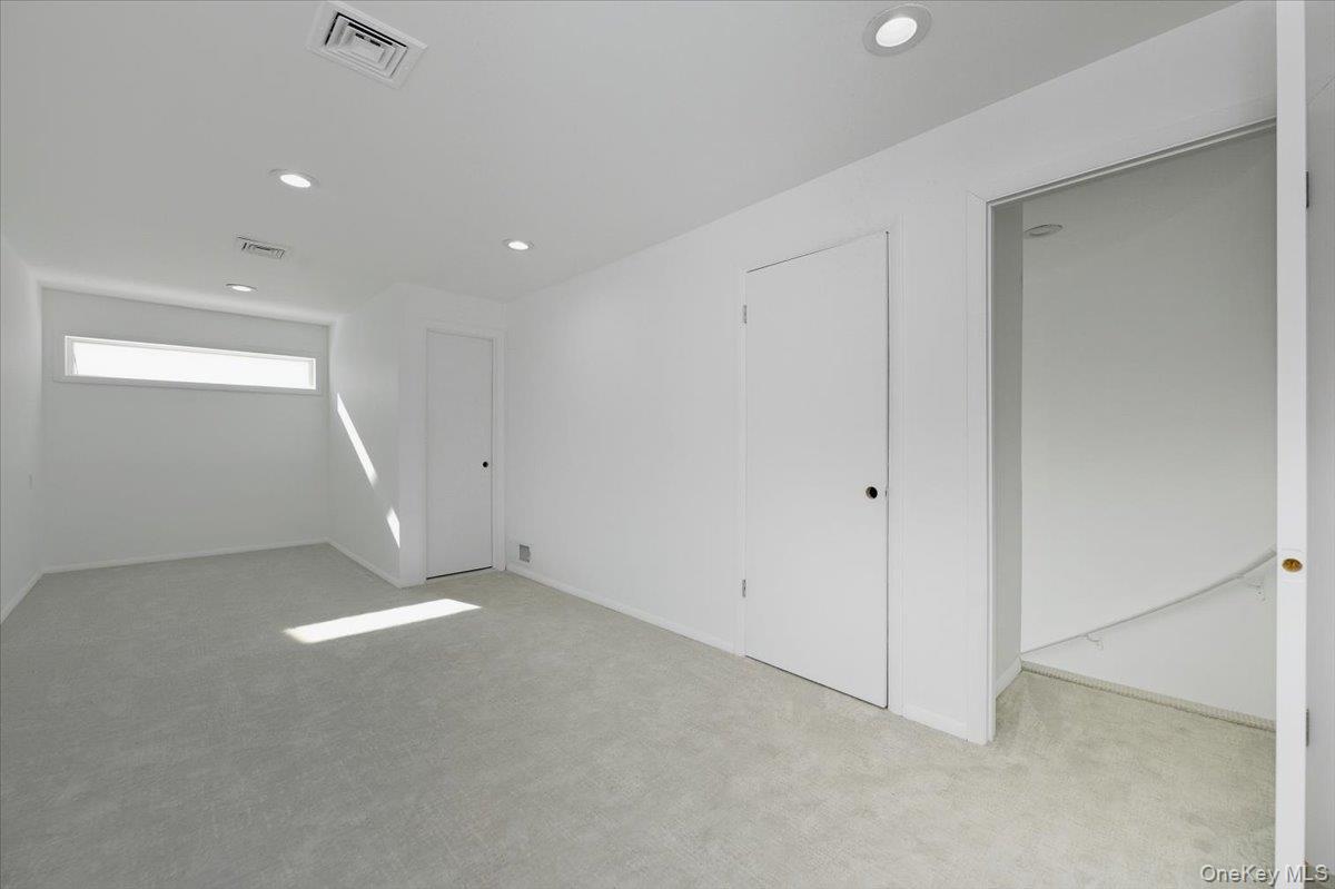 454 East Shore Road Great Neck, NY 11024 - Photo 36 of 48 an empty room with a empty space