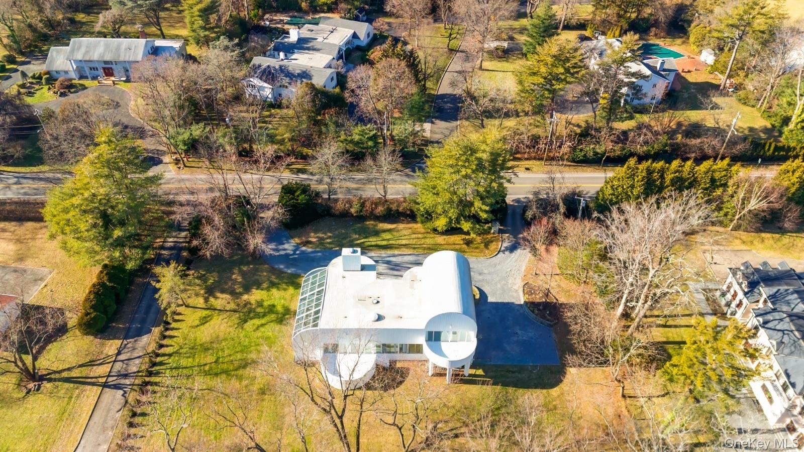 454 East Shore Road Great Neck, NY 11024 - Photo 38 of 42 an aerial view of residential houses with yard