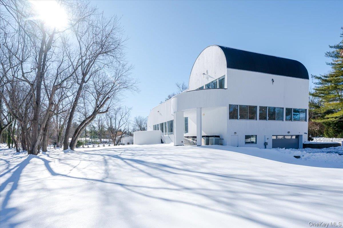 454 East Shore Road Great Neck, NY 11024 - Photo 42 of 42 a swimming pool with outdoor seating and yard