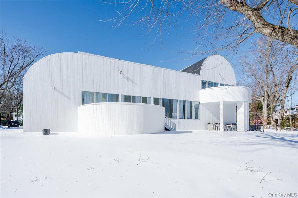 454 East Shore Road Great Neck, NY 11024 - Photo 46 of 48 a view of a building with a snow on the road