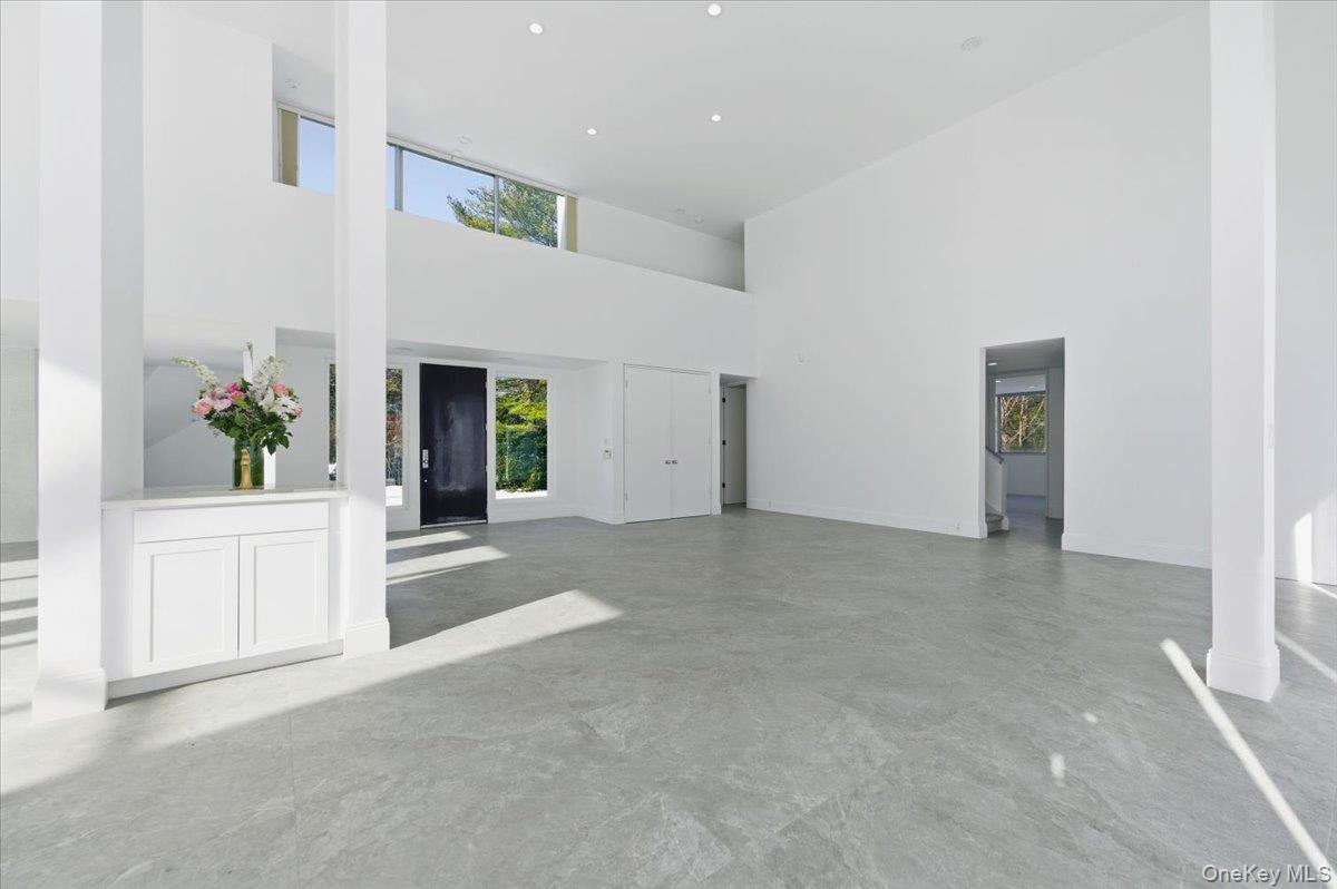 454 East Shore Road Great Neck, NY 11024 - Photo 5 of 48 a view of an entryway and kitchen