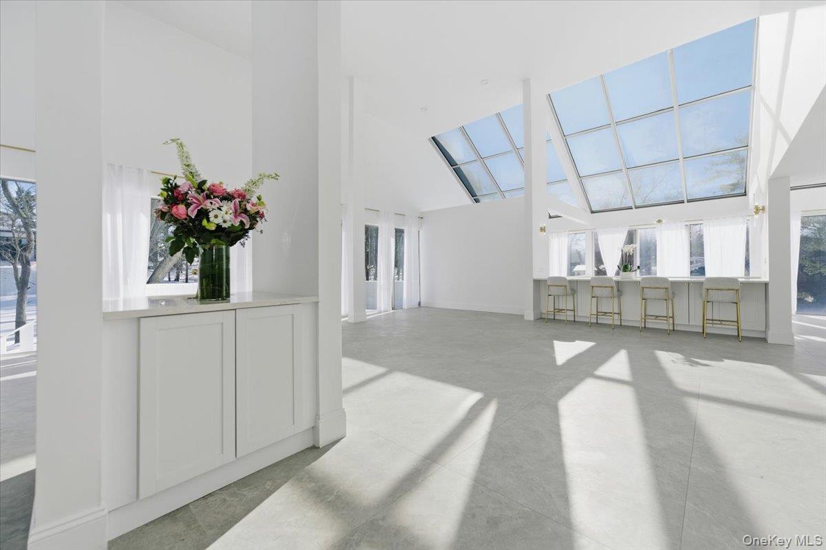 454 East Shore Road Great Neck, NY 11024 - Photo 7 of 42 a view of a living room and entryway