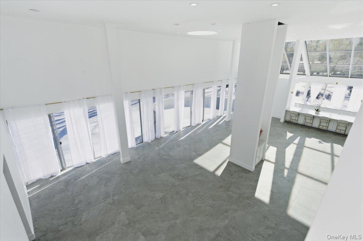 454 East Shore Road Great Neck, NY 11024 - Photo 9 of 48 view of an empty room with wooden floor