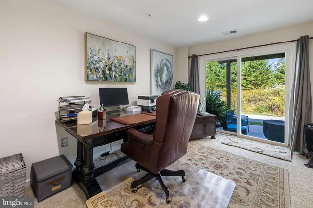 a workspace with furniture and a window