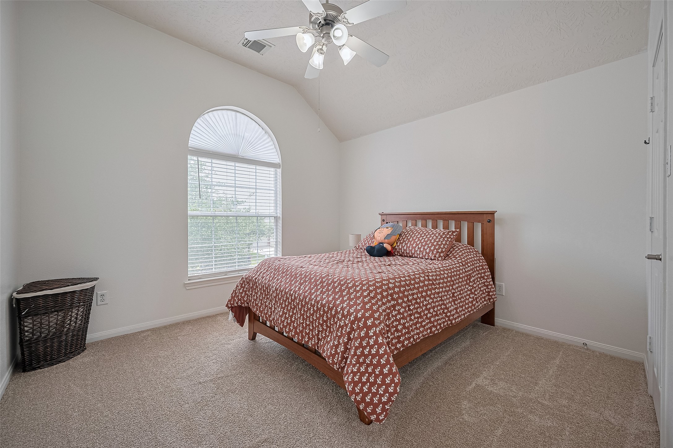 21506 Avalon Queen Drive Spring, TX 77379 - Photo 31 of 46 A stunning arched window floods the space with natural light, creating the perfect cozy spot for reading or unwinding.