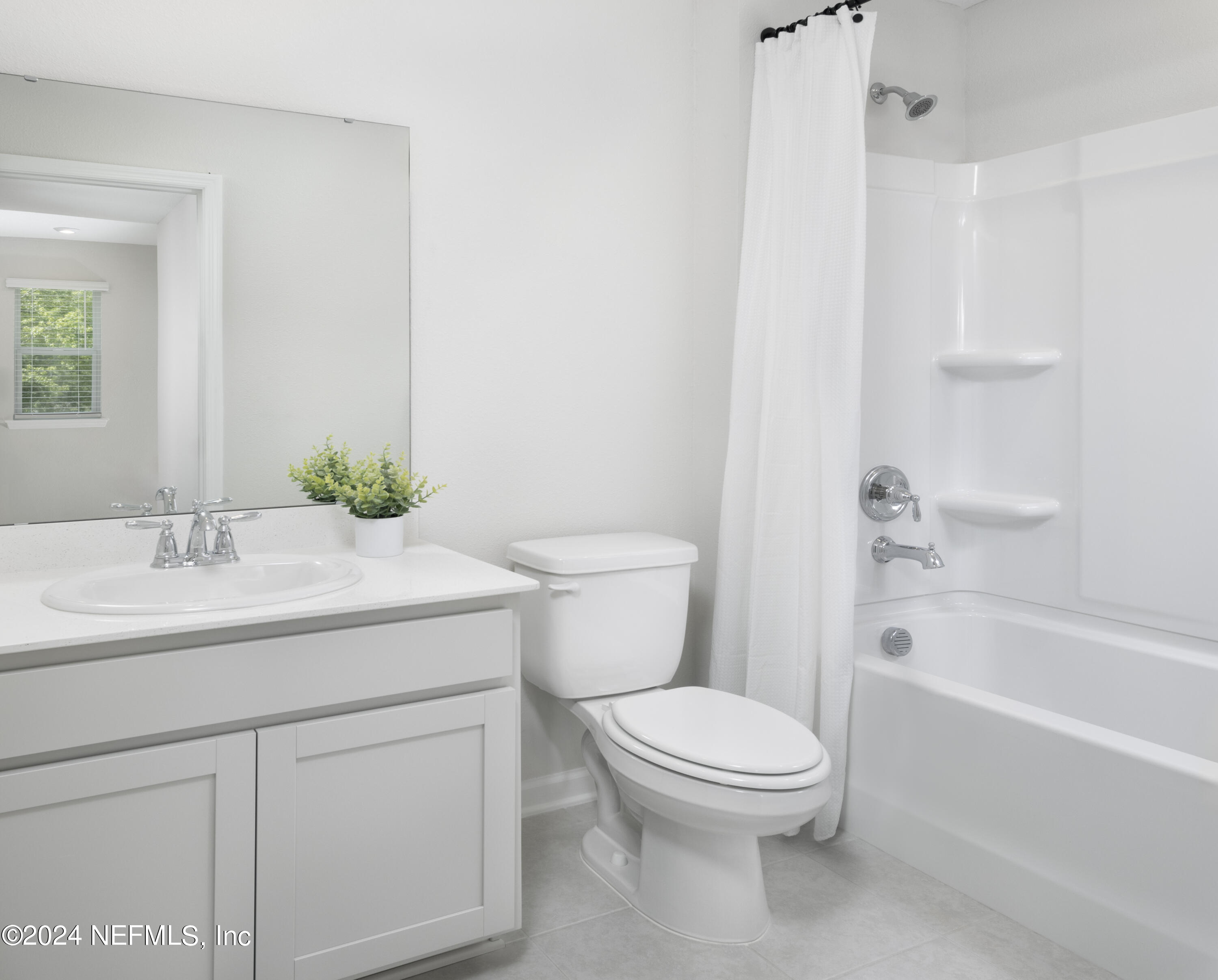 159 Harrow Cove St. Johns, FL 32259 - Photo 8 of 65 a bathroom with a granite countertop toilet a sink and a bathtub