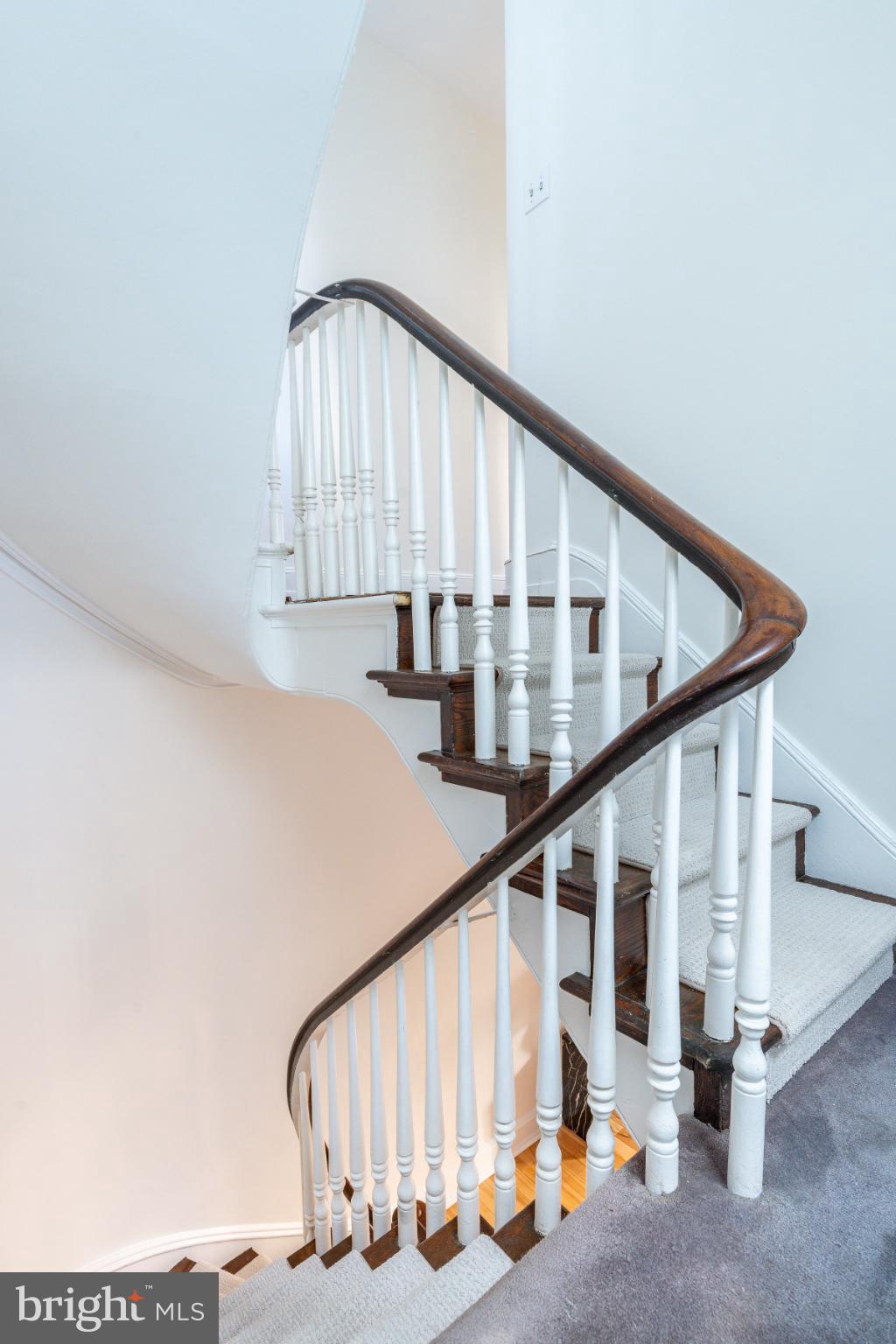 2046 Cherry Street Philadelphia, PA 19103 - Photo 22 of 61 Elegant spiral staircase with classic charm.