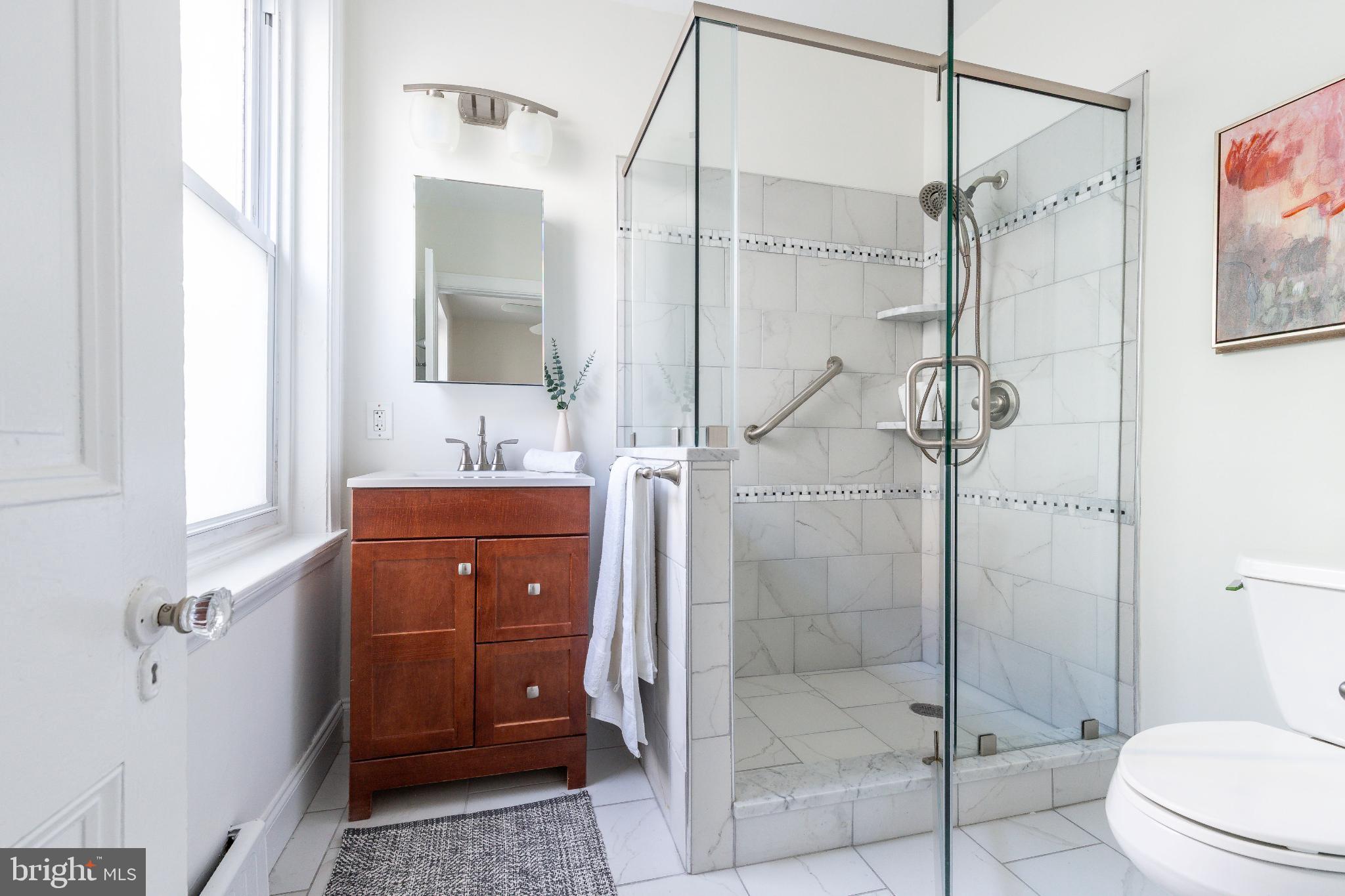 2046 Cherry Street Philadelphia, PA 19103 - Photo 28 of 61 Sleek modern bathroom with glass shower.