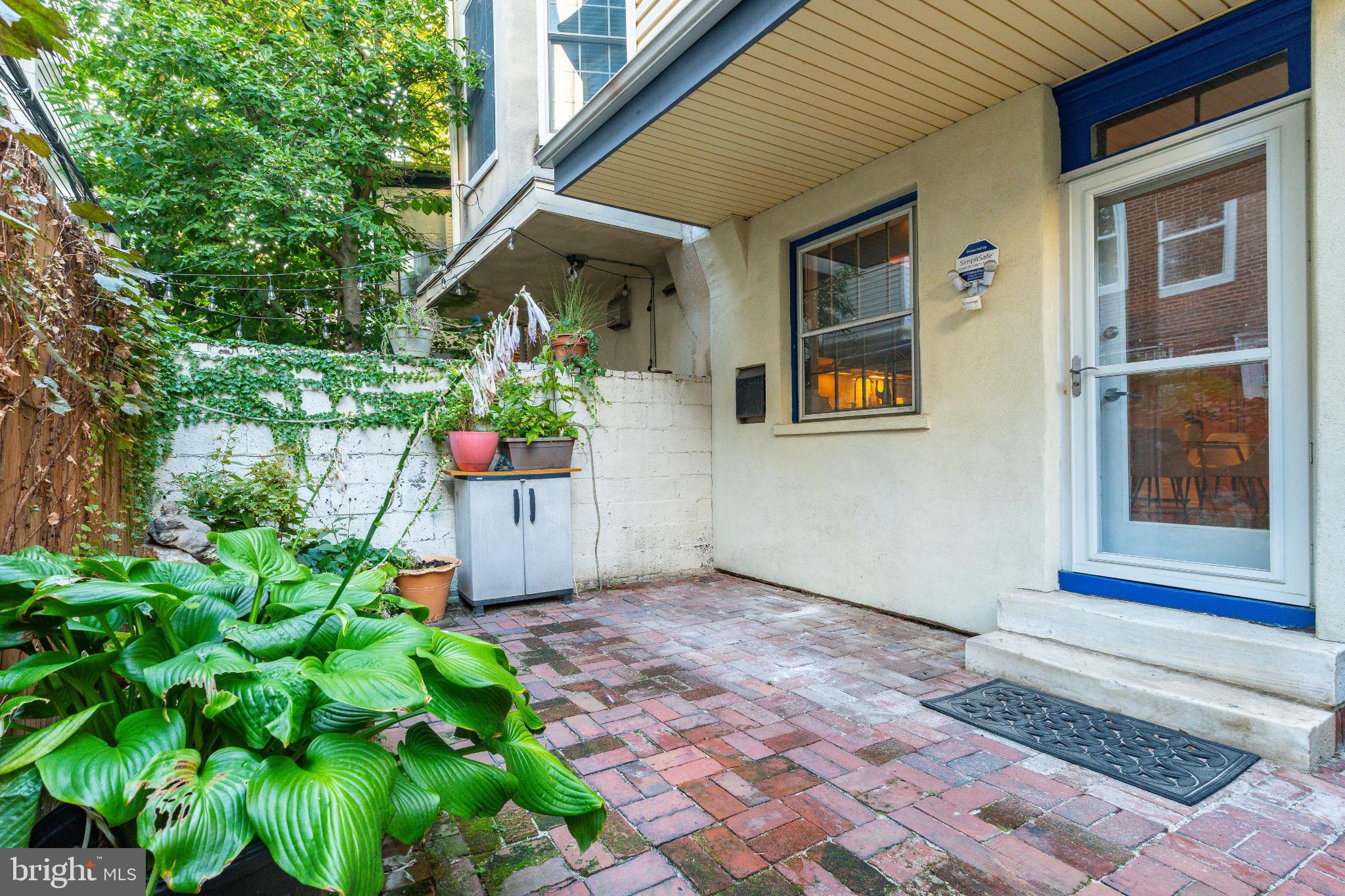 2046 Cherry Street Philadelphia, PA 19103 - Photo 45 of 61 Charming patio oasis with lush greenery.