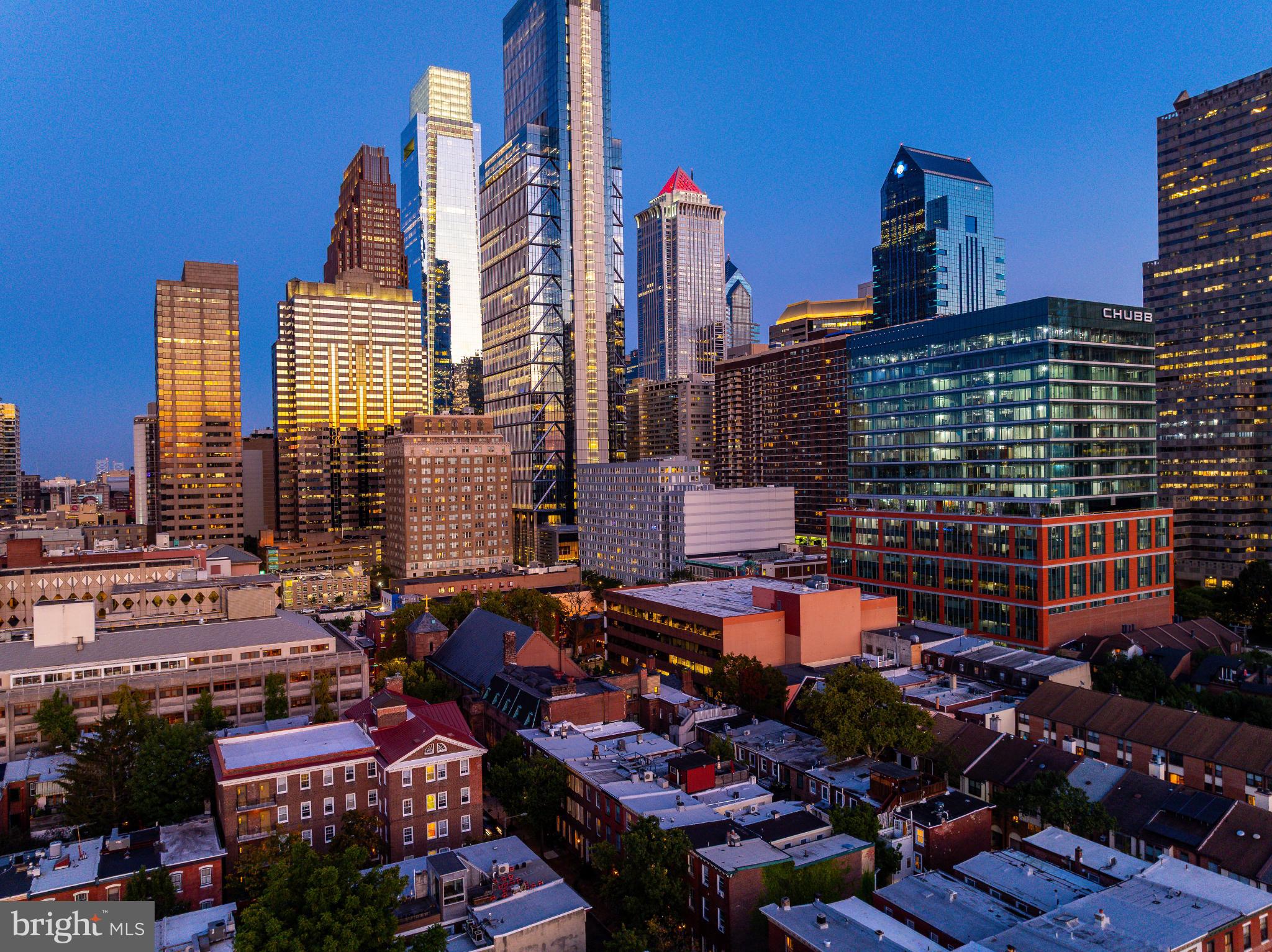 2046 Cherry Street Philadelphia, PA 19103 - Photo 50 of 61 City skyline at dusk, vibrant urban life.