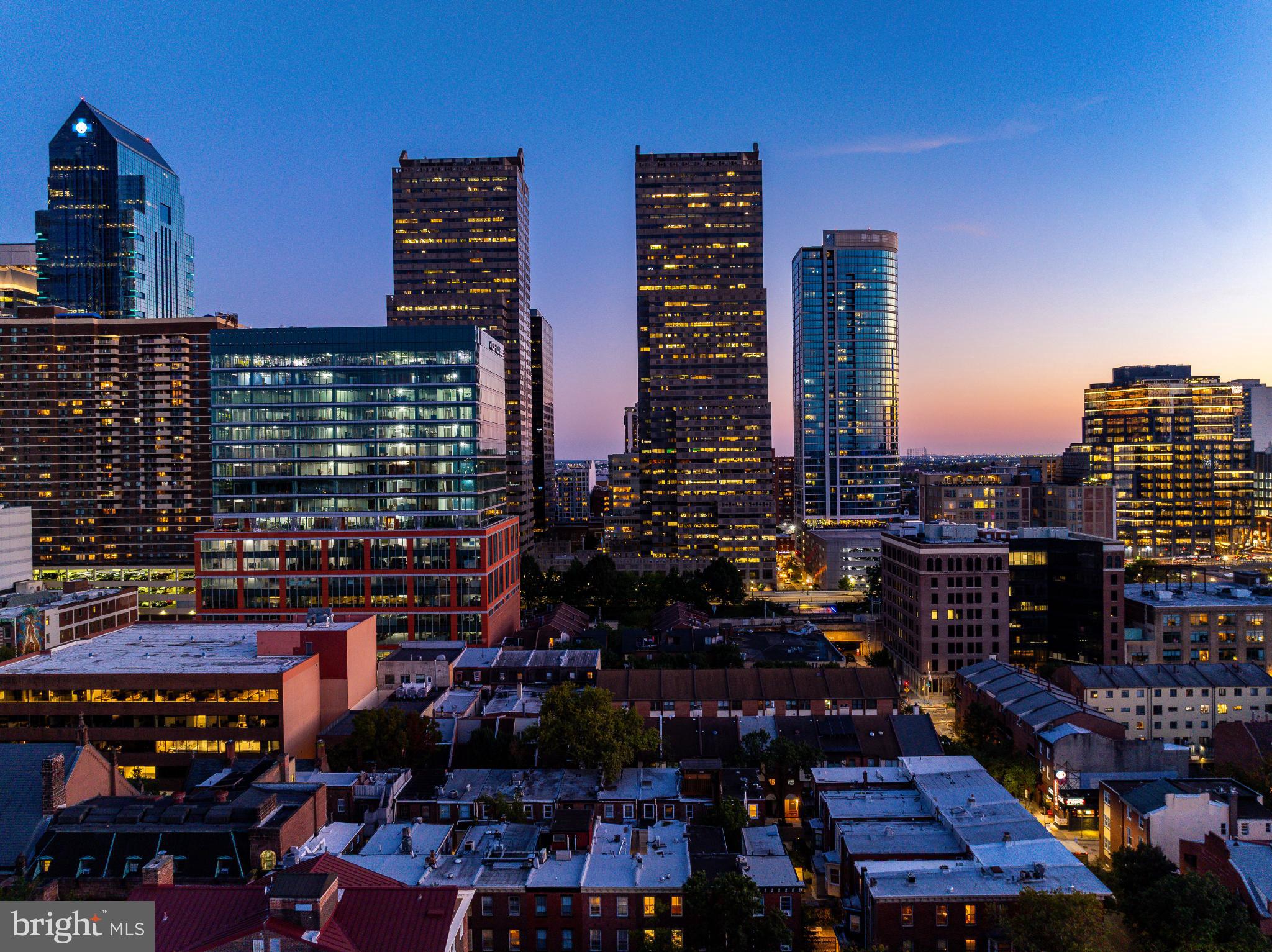 2046 Cherry Street Philadelphia, PA 19103 - Photo 52 of 61 City skyline at dusk, lights aglow.