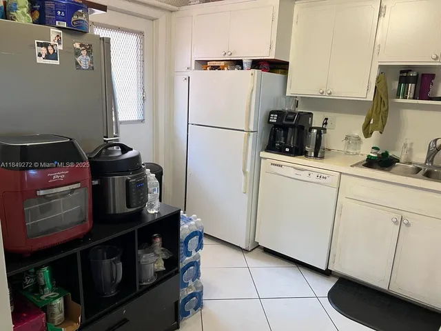 a kitchen with a stove and a refrigerator