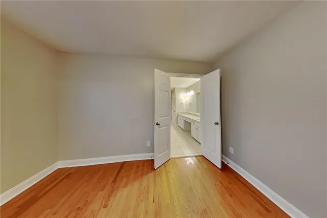 a view of an empty room and wooden floor