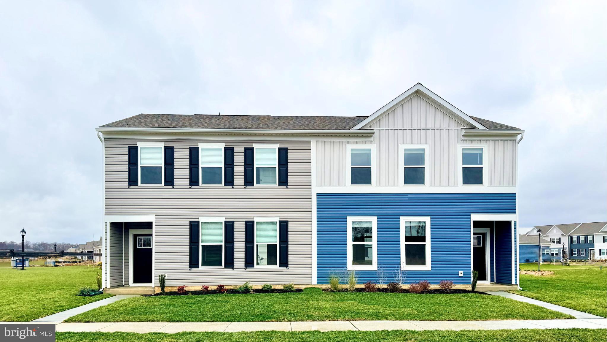 104 Red Haven Way Dover, DE 19904 - Photo 1 of 33 a front view of a house with a yard