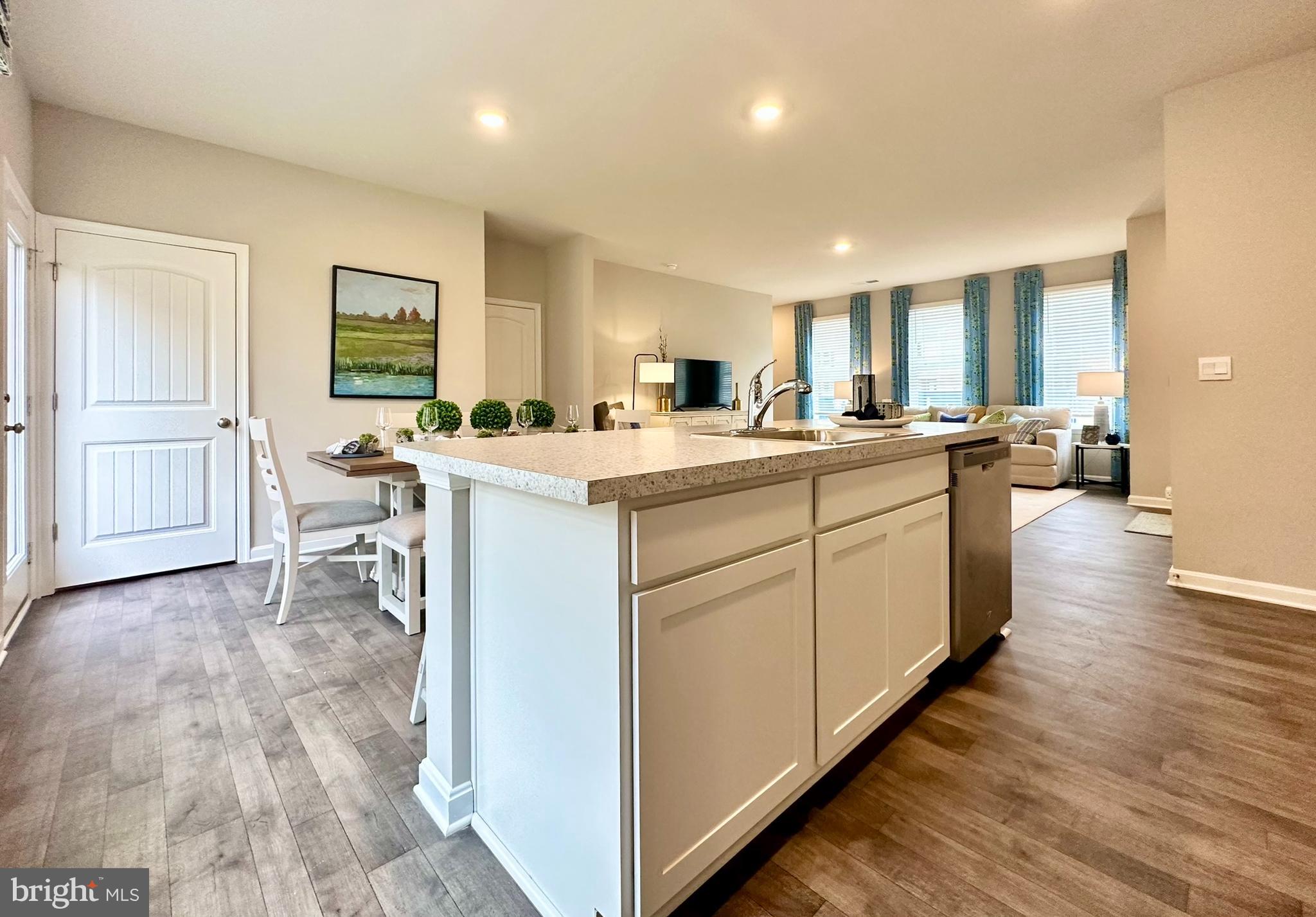 104 Red Haven Way Dover, DE 19904 - Photo 15 of 33 a kitchen with a sink cabinets and wooden floor