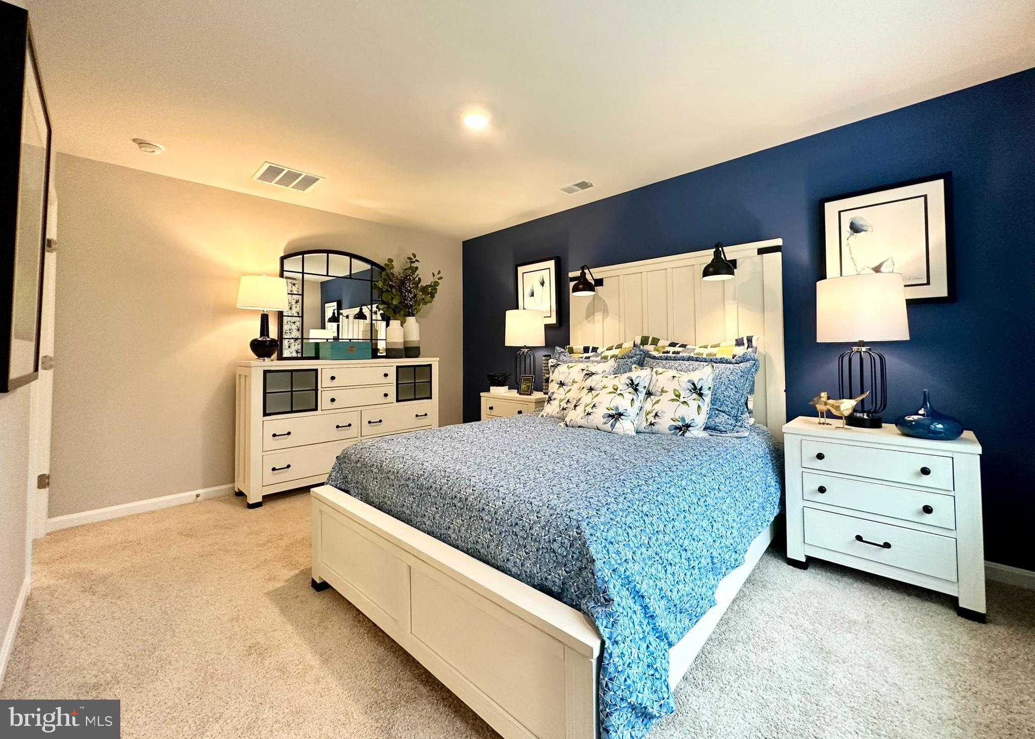 104 Red Haven Way Dover, DE 19904 - Photo 20 of 33 a spacious bedroom with a bed and window