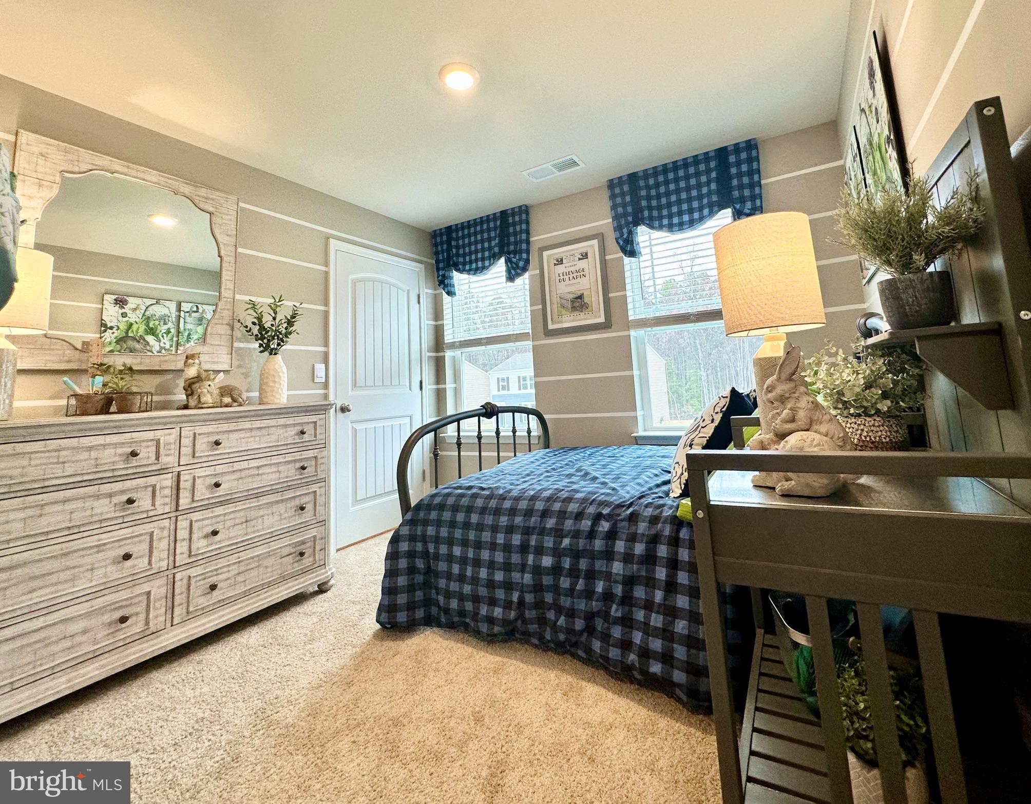 104 Red Haven Way Dover, DE 19904 - Photo 25 of 33 a bedroom with a bed dresser and a lamp