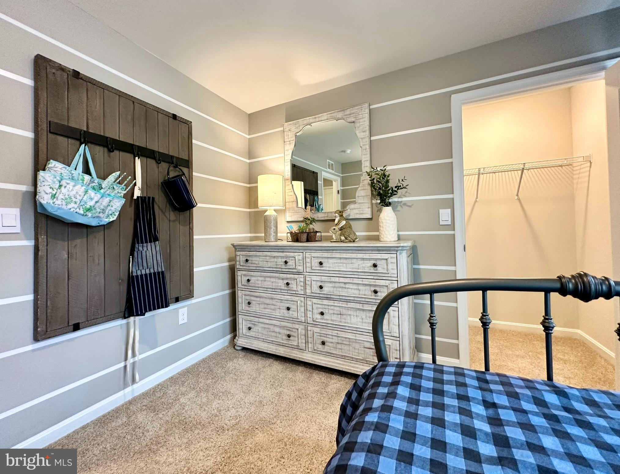 104 Red Haven Way Dover, DE 19904 - Photo 26 of 33 a bedroom with a bed and a window