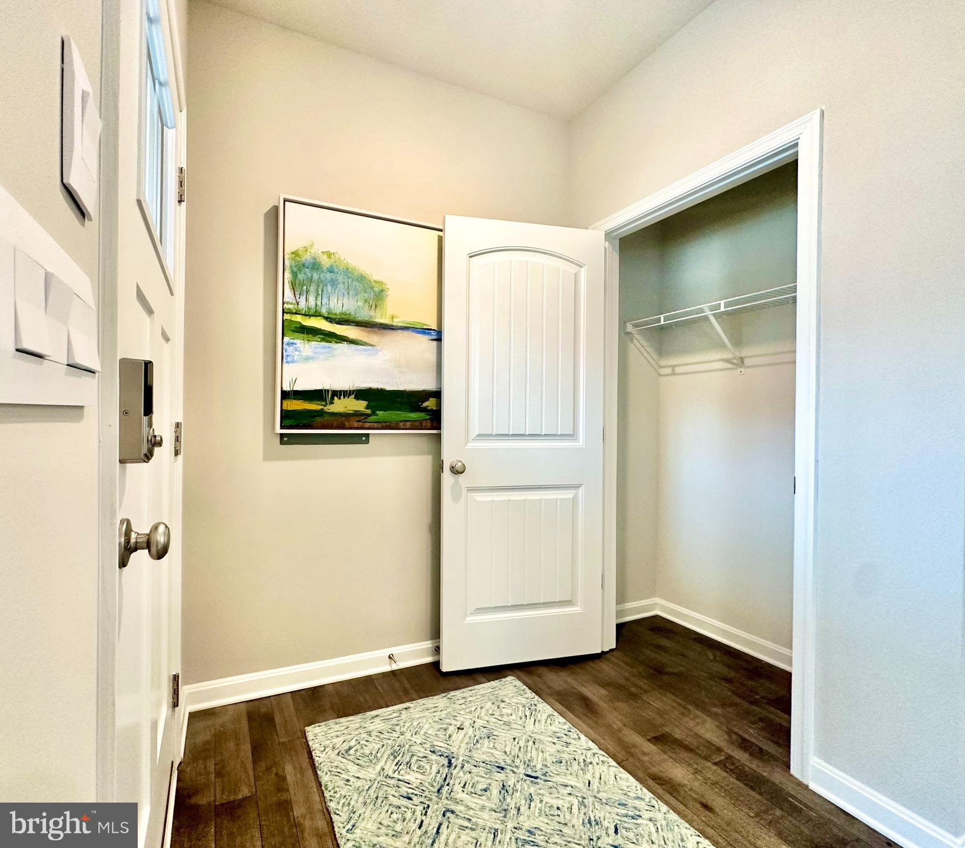 104 Red Haven Way Dover, DE 19904 - Photo 3 of 33 a view of an empty room with wooden floor and a window