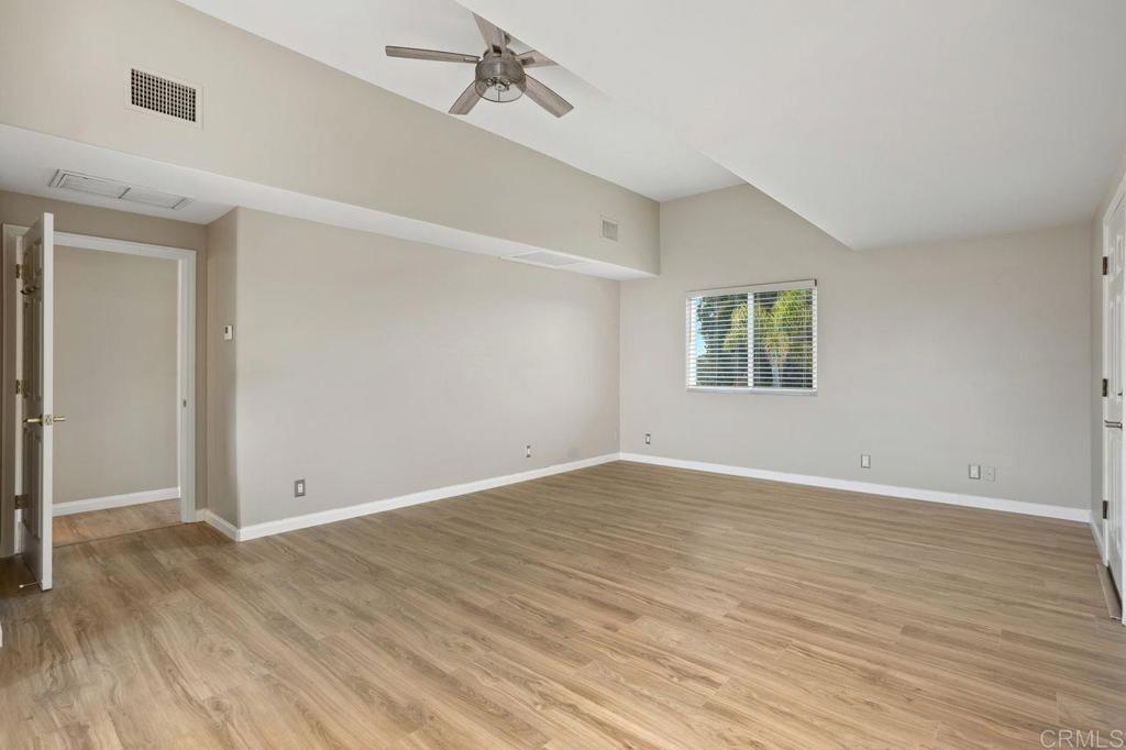 2380 Jefferson Street, Unit B Carlsbad, CA 92008 - Photo 11 of 25 a view of an empty room with wooden floor and a window