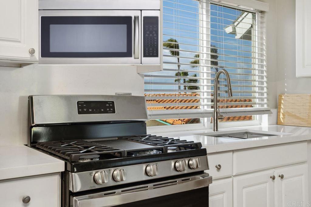 2380 Jefferson Street, Unit B Carlsbad, CA 92008 - Photo 13 of 25 a stove top oven sitting inside of a kitchen