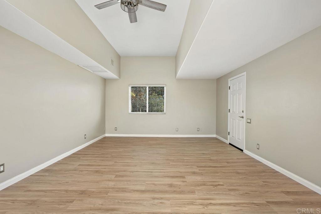 2380 Jefferson Street, Unit B Carlsbad, CA 92008 - Photo 15 of 25 a view of an empty room with a window and wooden floor