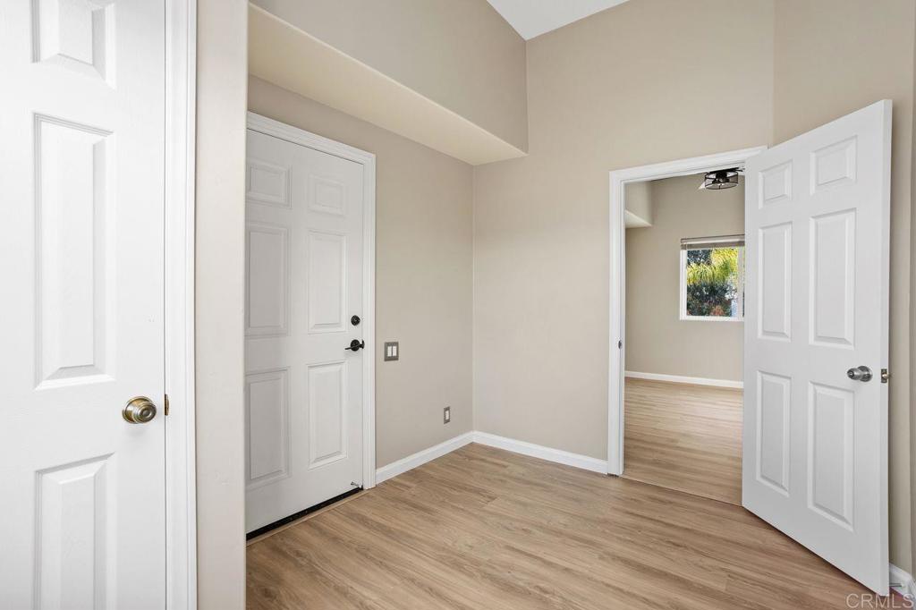 2380 Jefferson Street, Unit B Carlsbad, CA 92008 - Photo 21 of 25 a view of a hallway with wooden floor
