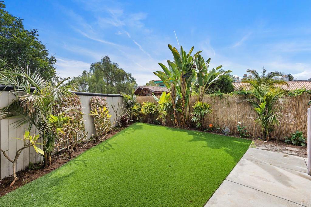 2380 Jefferson Street, Unit B Carlsbad, CA 92008 - Photo 3 of 25 a view of a yard with plants and palm trees