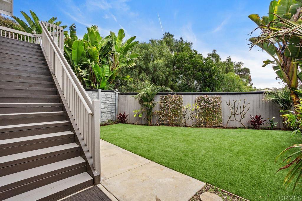 2380 Jefferson Street, Unit B Carlsbad, CA 92008 - Photo 5 of 25 a view of a backyard with potted plants and a bench