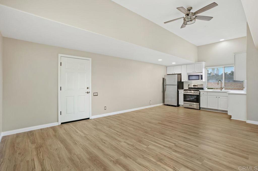 2380 Jefferson Street, Unit B Carlsbad, CA 92008 - Photo 9 of 25 a view of a kitchen with a sink and dishwasher a refrigerator with wooden floor