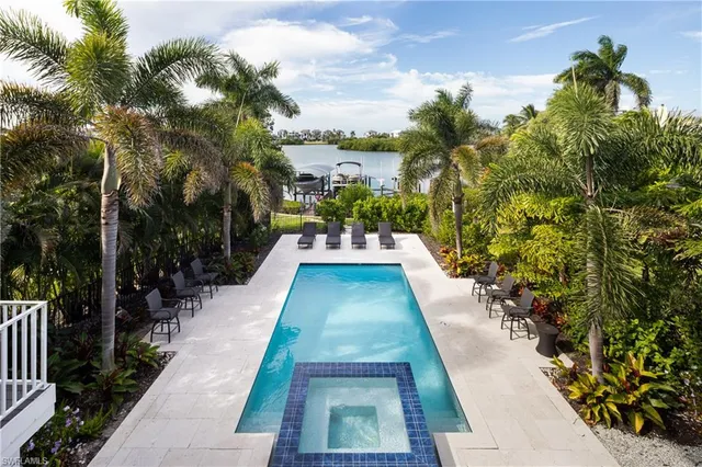 a view of flowing water with large trees