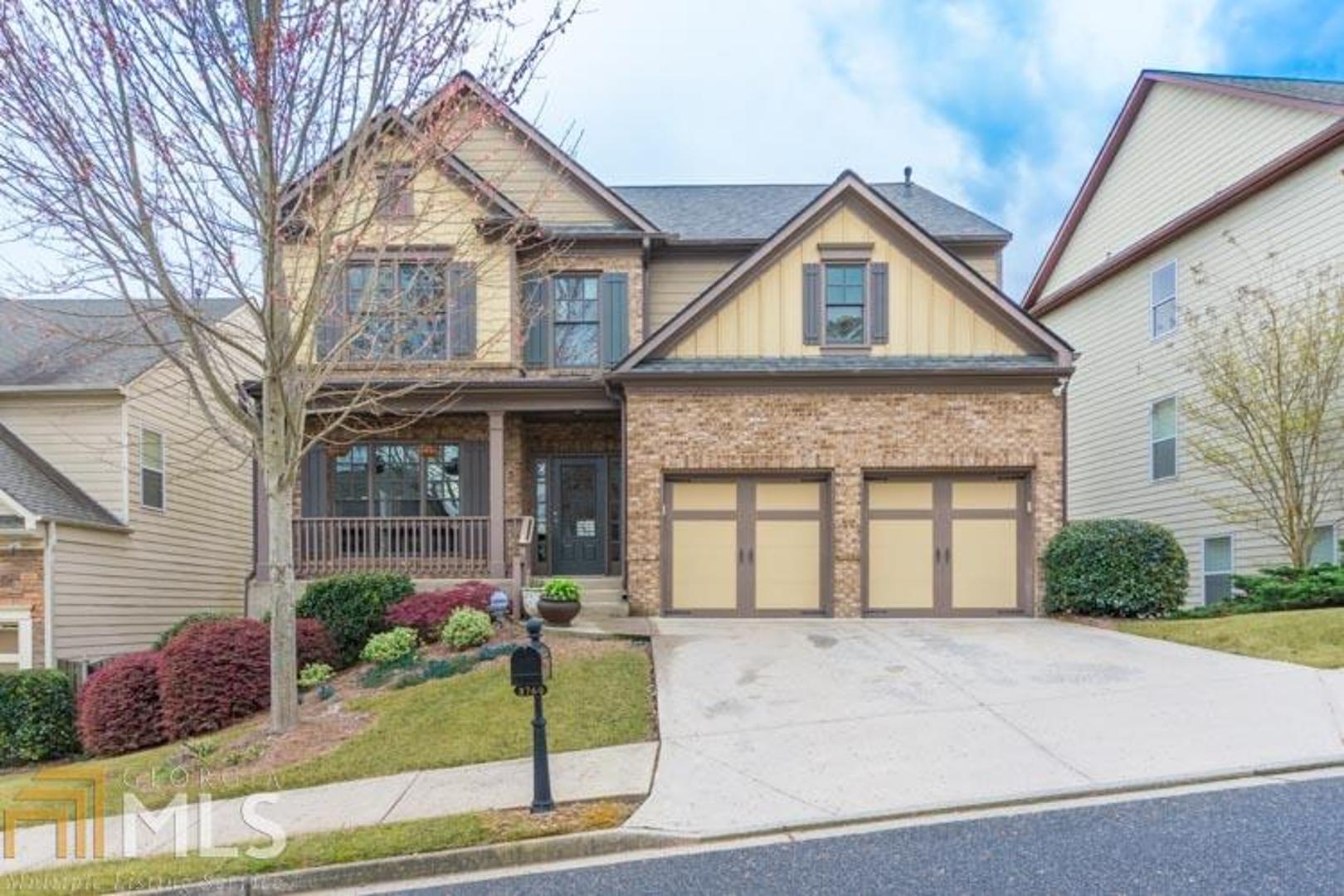 3760 Silver Springs Road, Unit 834 Cumming, GA 30041 - Photo 1 of 1 a front view of a house with garden
