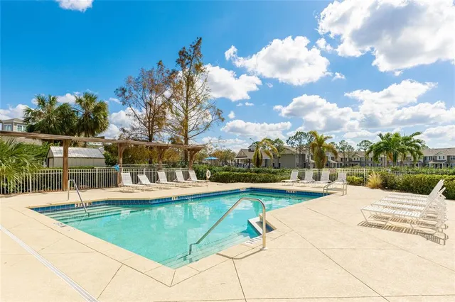 a front view of a house with garden and outdoor seating