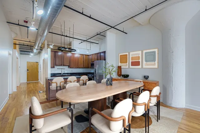 a view of a dining room with furniture and a table