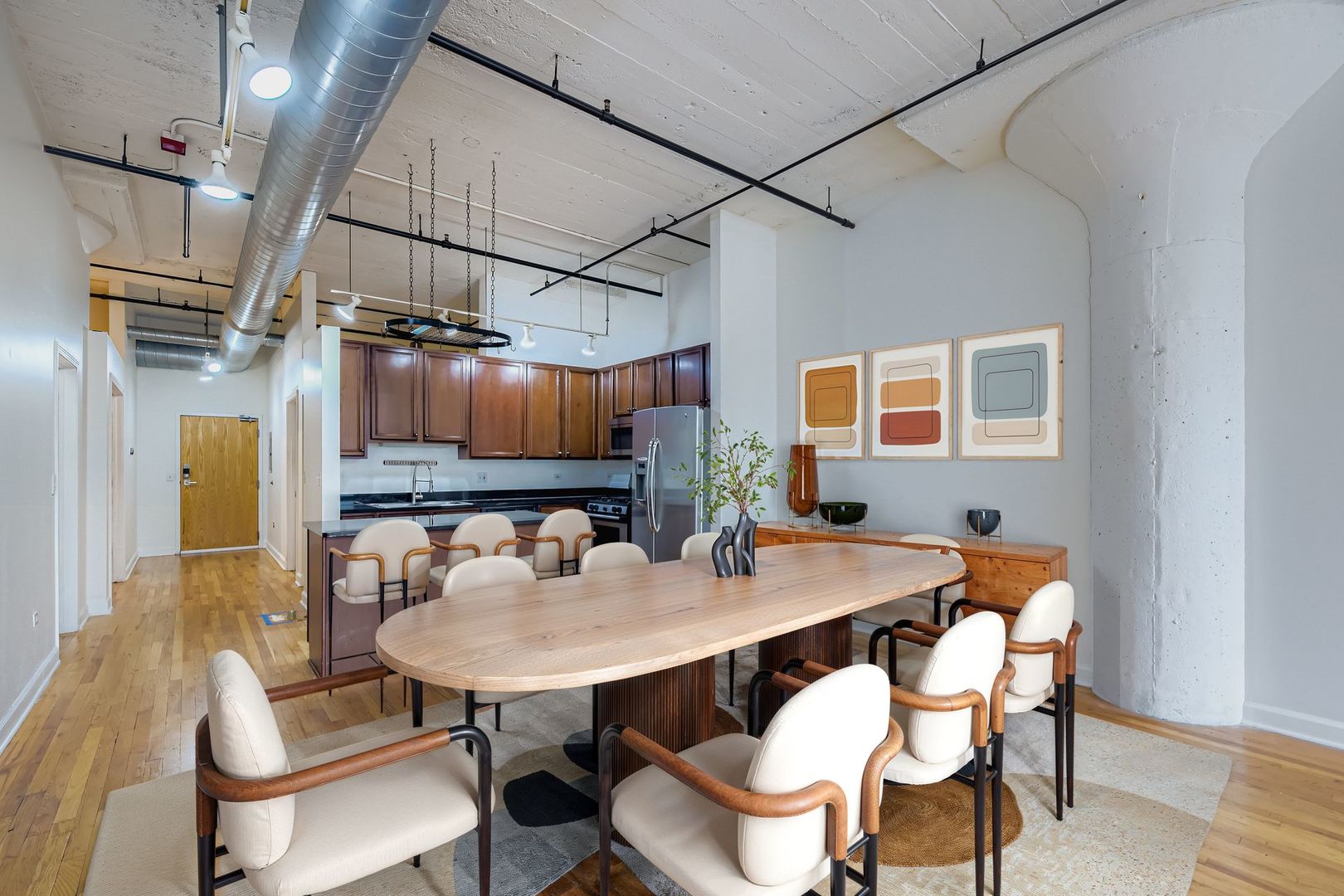 221 East Cullerton Street, Unit 317 Chicago, IL 60616 - Photo 3 of 16 a view of a dining room with furniture and a table