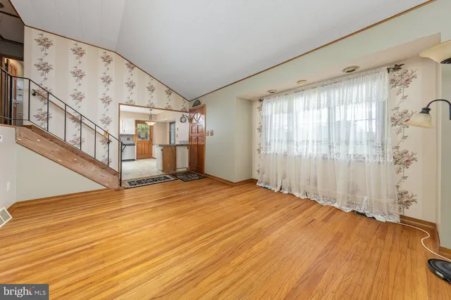 a kitchen with stainless steel appliances granite countertop a stove cabinets and refrigerator