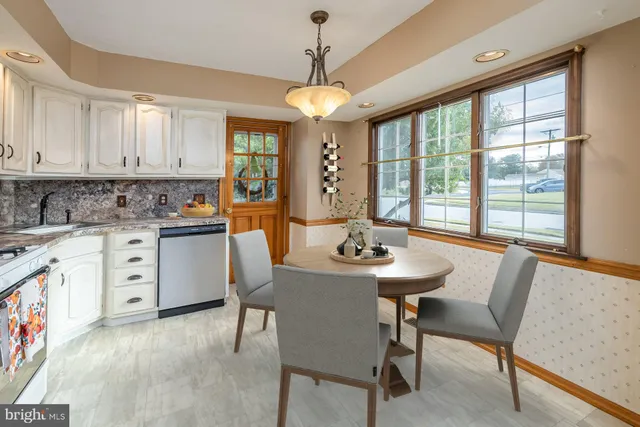 a kitchen with stainless steel appliances a stove a sink and a refrigerator