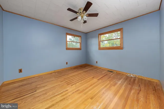a bedroom with bed and window