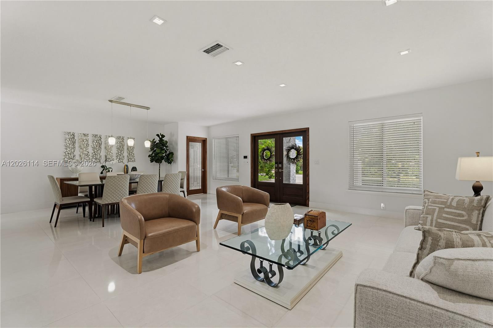 9641 Southwest 66th Street Miami, FL 33173 - Photo 10 of 57 a living room with furniture and a large window