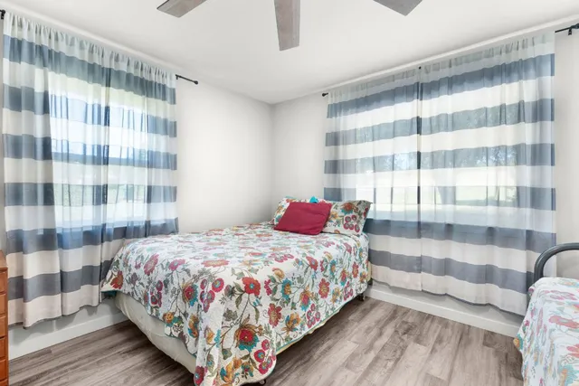 a view of a house with a garden and lake view