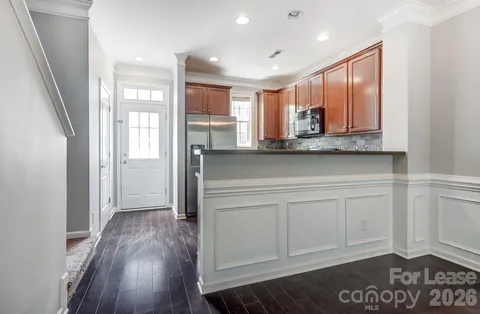 a view of kitchen with wooden floor