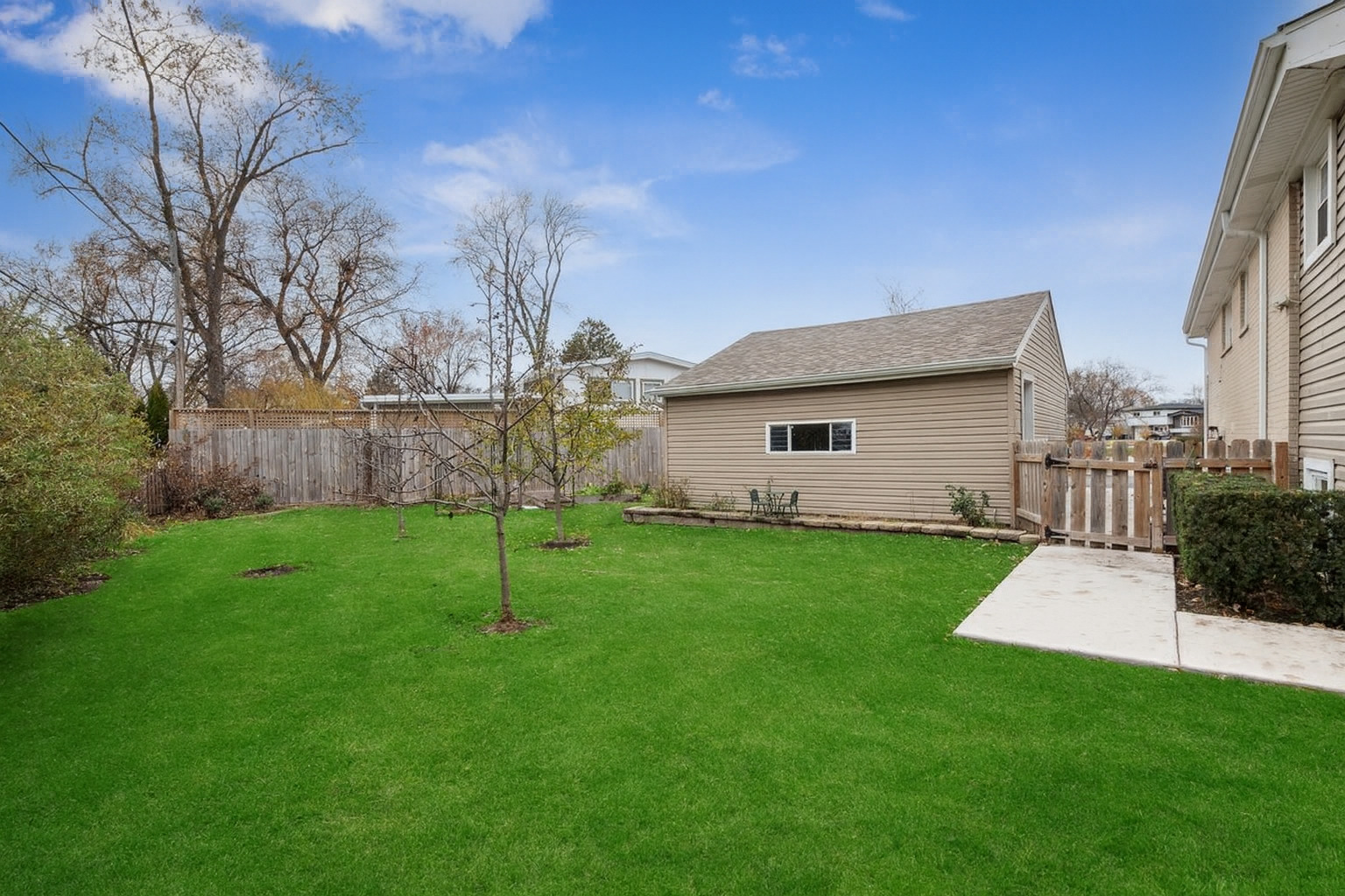 241 Glendale Road Glenview, IL 60025 - Photo 24 of 29 a view of a house with backyard and a tree