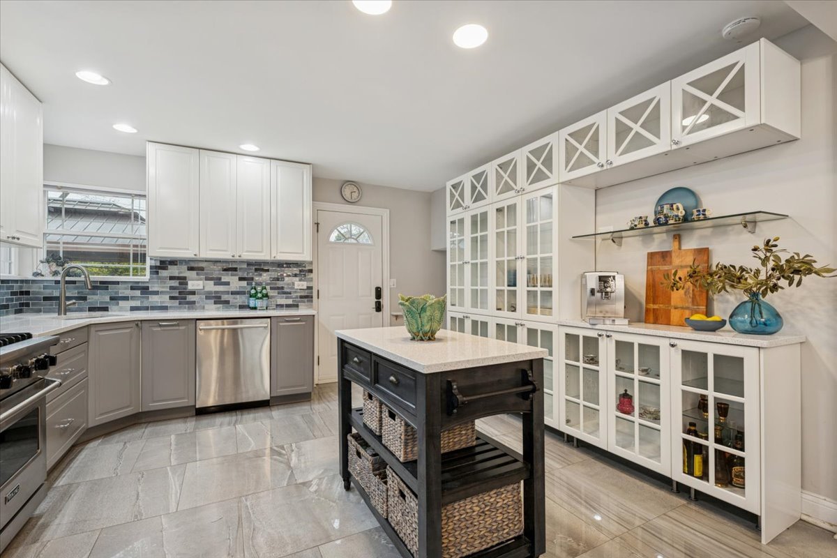 241 Glendale Road Glenview, IL 60025 - Photo 8 of 29 a kitchen with stainless steel appliances a stove a sink and a refrigerator