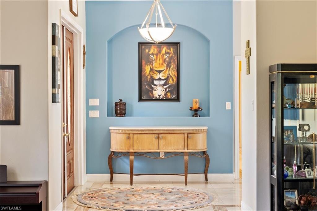 4281 68th Avenue Northeast Naples, FL 34120 - Photo 20 of 41 a view of hallway with window and wooden floor