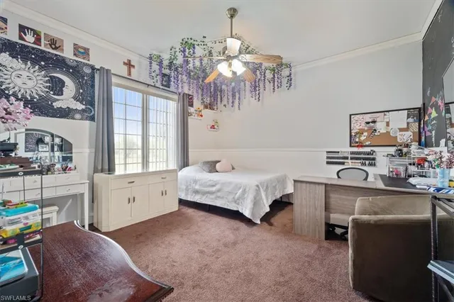 a bedroom with a bed dresser and a window